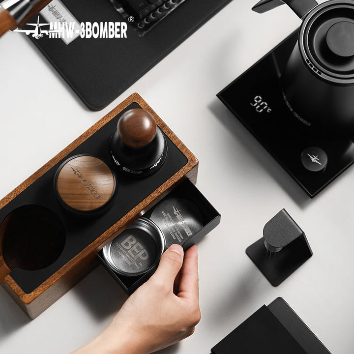MHW-3BOMBER multifunctional portafilter holder tamping station in walnut with black (Walnut/Black) with open drawer, seen from above