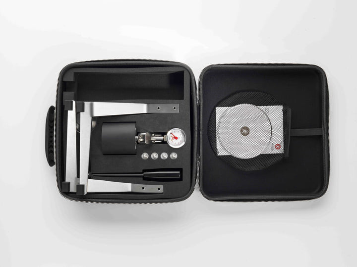 Olympia Express Mina in black inside the open travel case