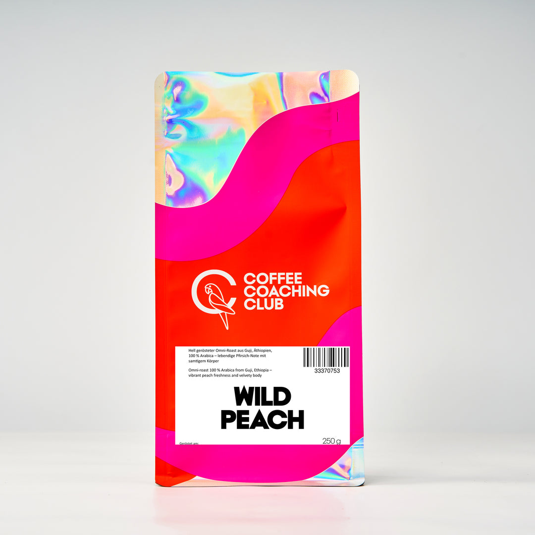 Wild Peach coffee beans 250 g – light-roasted omniroast, 100% Arabica from Guji, Ethiopia, with a peach note – bag by Coffee Coaching Club